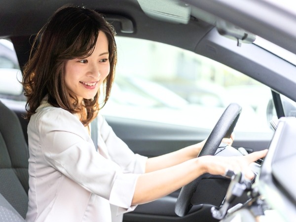 Woman Driving a Car
