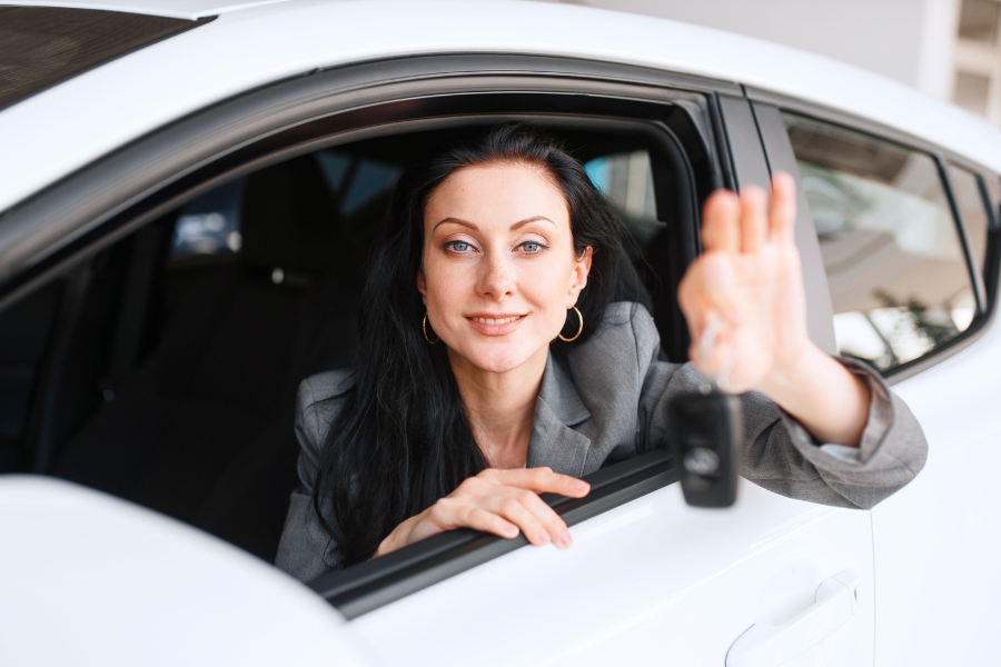 Woman Driving a White Car