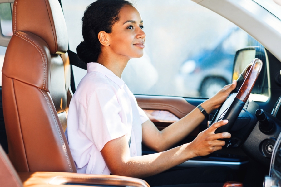 Woman Driving a White Car