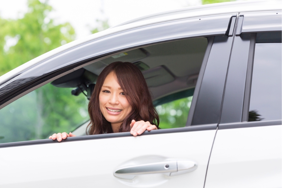 Woman with a Rental Car